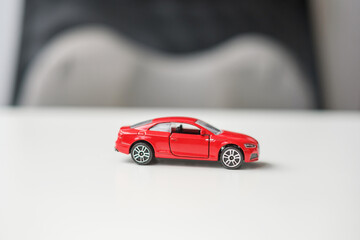 red car toy. Car insurance, warranty, rental, Financial, new and repair concept