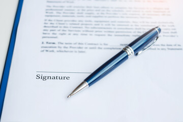 signature with pen on contract documents. Contract agreement, approve, law and deal concepts
