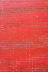 Fototapeta na wymiar Brick wall made of decorative red bricks.