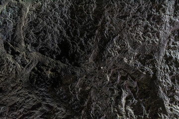 Closeup black rock background texture