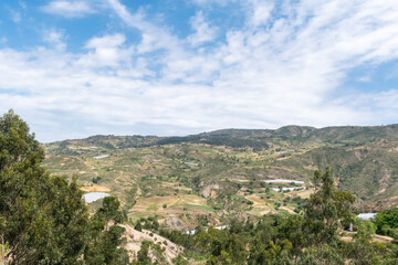 Fototapeta na wymiar green moutains with sky and clouds