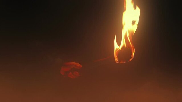 Man Holds Up Fire Torch In Thick Mist