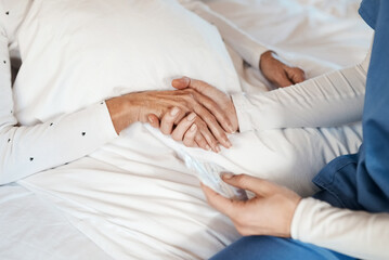 Give someone your hand and you give them hope. Cropped shot of a nurse holding hands with a senior woman.