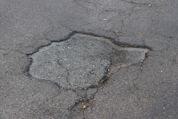 Asphalt Breaking Up Due to Sun and Rain