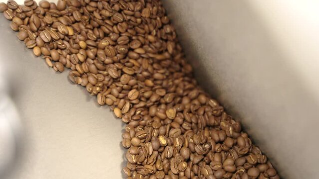 coffee beans are sucked in after roasting to be bottled later on