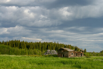 Abandoned ruined wooden house