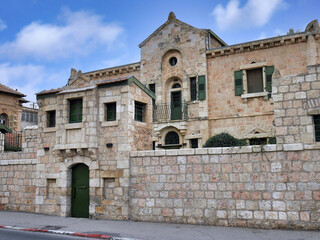 Fototapeta premium Old stone building with courtyard behind wall, Jerusalem