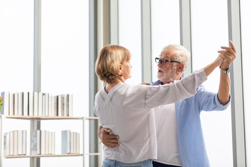 senior couple, elderly man and woman dancing together in free time