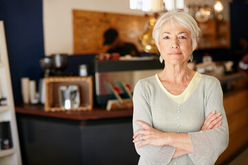 I invested in a small business after retirement. Portrait of a senior woman working in a coffee shop. - obrazy, fototapety, plakaty