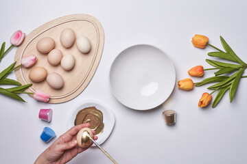 Happy easter time. Bright Easter holiday concept with spring flowers and easter eggs. Colorful Easter eggs background