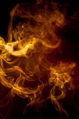Gold smoke on black background