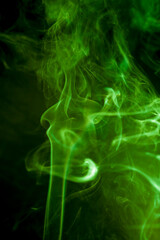 Green smoke on black background