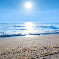 Fototapeta na wymiar close up sand beach with clear blue sea and sky