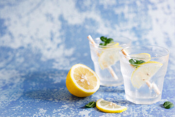 Iced lemonade soda drink with fresh mint leaves.