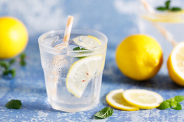 Iced lemonade soda drink with fresh mint leaves.