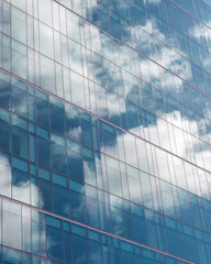 Fototapeta na wymiar sky reflected in modern office building
