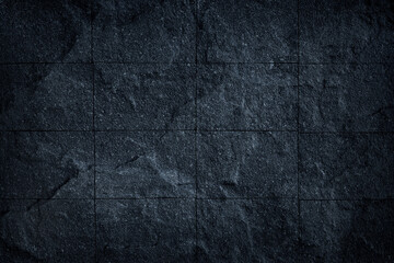 Dark grey black slate stone tile background or texture