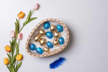 Happy easter time. Bright Easter holiday concept with spring flowers and easter eggs. Colorful Easter eggs background