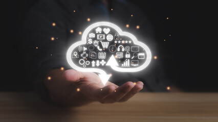 Businessman hand with cloud computing technology symbol. transformation and technology items such as upload download. cloud computing and technology concept.