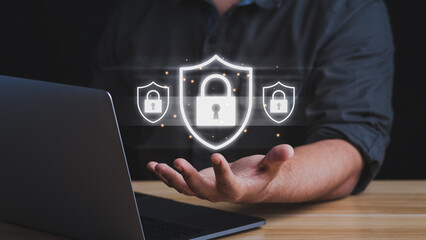 Businessman working with laptop computer for data protection, data security and encryption, secure access to users personal data. internet, cyber, firewall security concept.