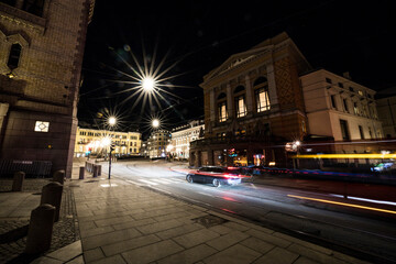 Fototapeta na wymiar Oslo, Norway Night scene and traffic downtown in Stortingsgata, or Parliament street.