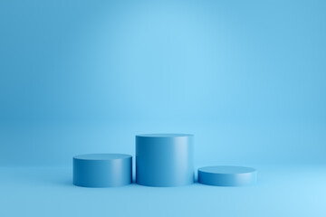 Winners podium or pedestal with empty cylindrical platforms on blue background.
