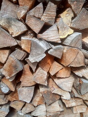 Birch firewood put in woodpile background