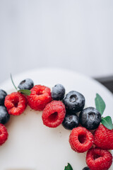 birthday cake with berries. Raspberry and blueberry.