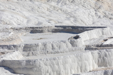 Obraz premium Carbonate travertines the natural pools during sunset, Pamukkale, Turkey
