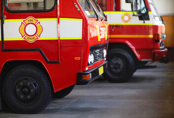 Ready for action. Cropped shot of parked fire engines.