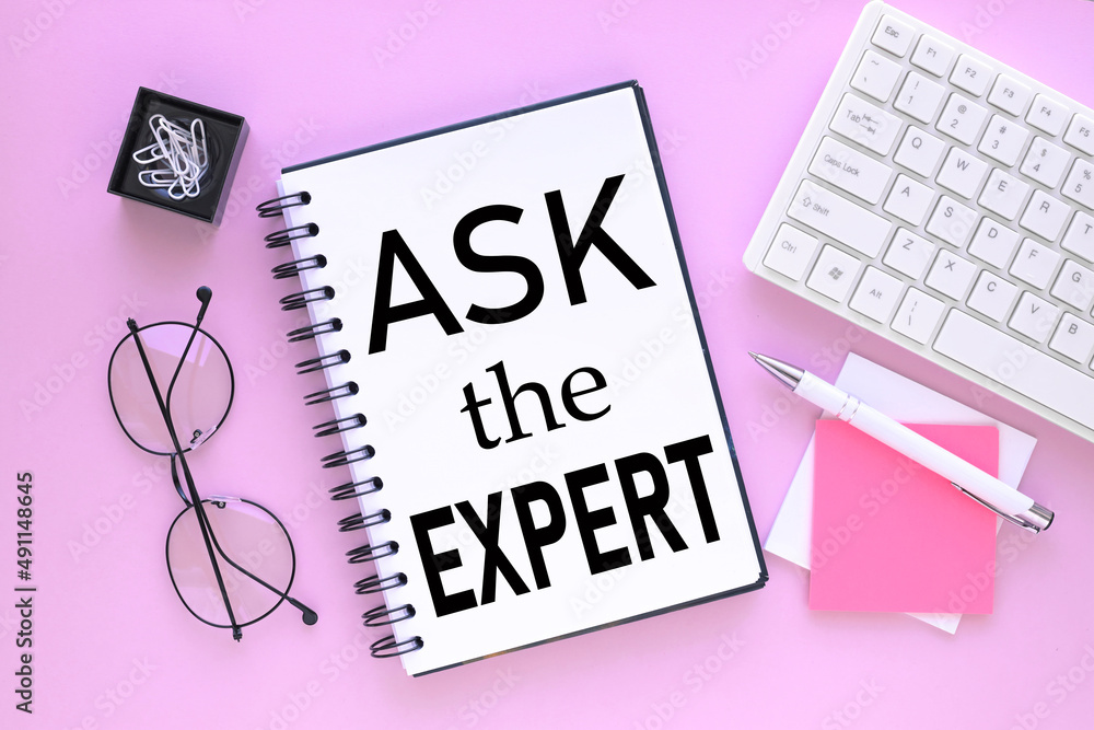 Poster open notepad white keyboard on pink background. text on an open notebook. ask the expert