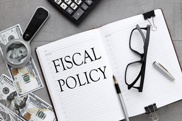 open diary on a gray background. text in an open notebook. fiscal policy