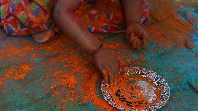 Indian Festive Theme - Happy Asian Kid Baby Girl Having Fun With Non Toxic Herbal Holi Color Powder Called Gulal Or Abir Rang Abeer During Hindu Ritual Dol Purnima. Holiday Outdoor Fun Activity