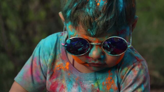 Indian Festive Theme - Happy Asian Kid Baby Boy Having Fun With Non Toxic Herbal Holi Color Powder Called Gulal Or Abir Rang Abeer During Hindu Ritual Dol Purnima. Holiday Outdoor Fun Activity