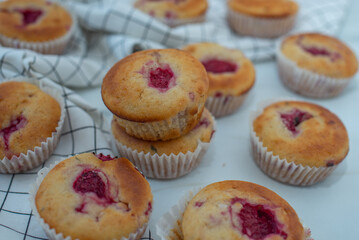 sweet vanilla raspberry muffins on a table