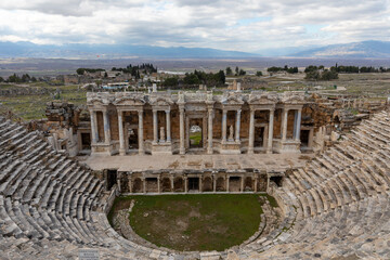 Amphitheater in ancient city of the Hierapolis. Dramatic sunset sky. Unesco Cultural Heritage...