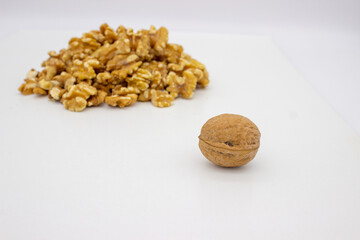 Peeled walnuts on white background