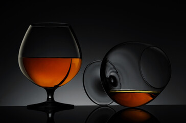 Elegant glasses of luxury whiskey on a dark background