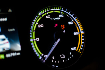 Digital modern dashboard in a electric vehicle - EV while charging at the charging station.