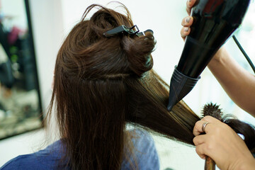 Fototapeta premium Asian young woman have a hair cutting and spa by professional beauty hair dresser. 