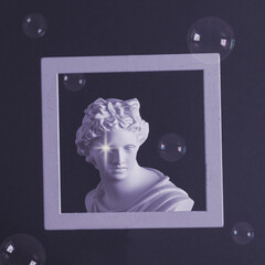Apollo statue in a frame on a purple background with soap bubbles. Collage of contemporary art.