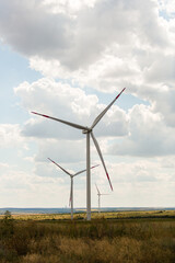 green energy three wind generators in the field