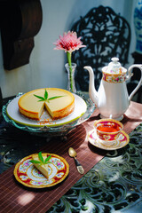 Cheesecake dessert pie, dairy recipe homemade on table. Delicious fresh peace of cake slice on plate. Tasty sweet food cannabis leaves on top. Morning gourmet plate closeup dish photography.