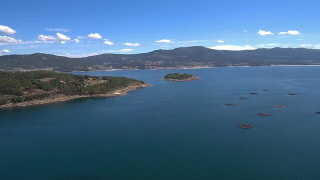 Aerial View Of Illa De Creba With Mussel Seafood farms in Ria Muros y Noya Galicia Spain. Dolly Forward