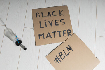 Black lives matter and fight against racism and write sign and words on cardboard - protest concept...