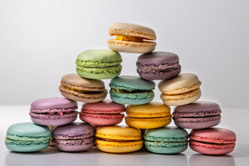 Fototapeta na wymiar Colorful macaroons on a wooden table white background