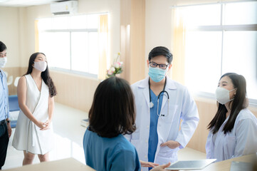 Fototapeta premium professional doctor and medicine person team have a conversation to talking in hospital about medical health care work, wearing surgical face mask