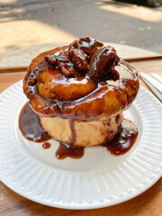 Fresh sweet homemade Brioche bread topped with pecan nut and caramel