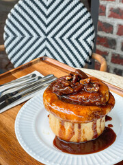 Fresh sweet homemade Brioche bread topped with pecan nut and caramel