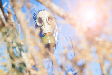 Environmental disaster. Post apocalyptic survivor in gas mask with a lab suit. science fiction...